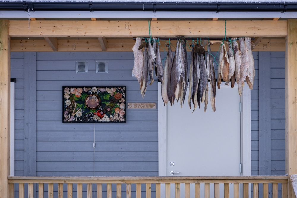 Stockfisch an einem Haus in Husøy - Foto: Annekathrin Linge